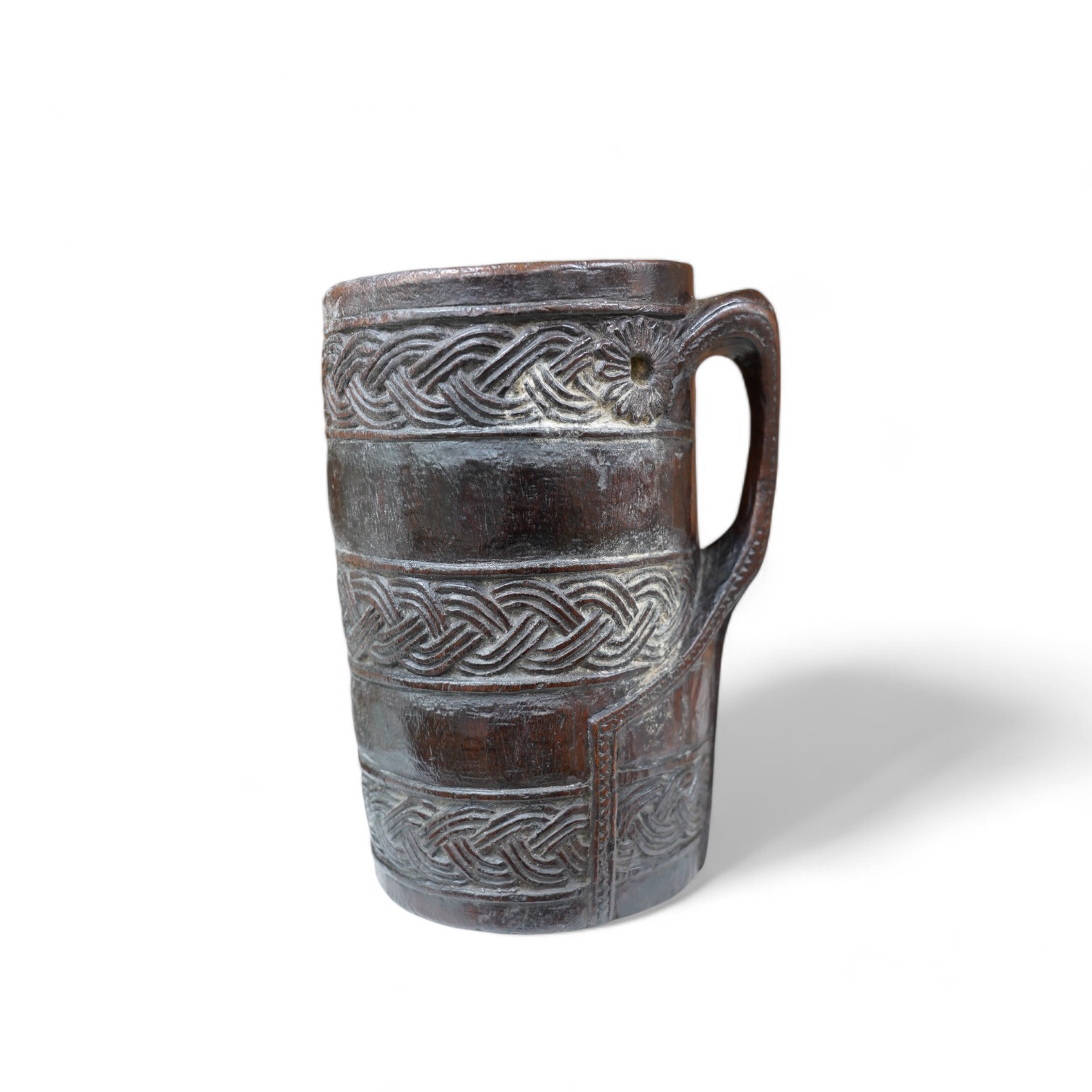 A Scandinavian carved wood tankard, lacking lid, 24cm. Condition - commensurate with age